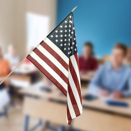 A flag flies in a classroom