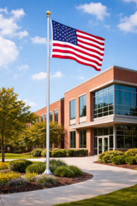 A Nyl-Glo Flag flies in front of a school.