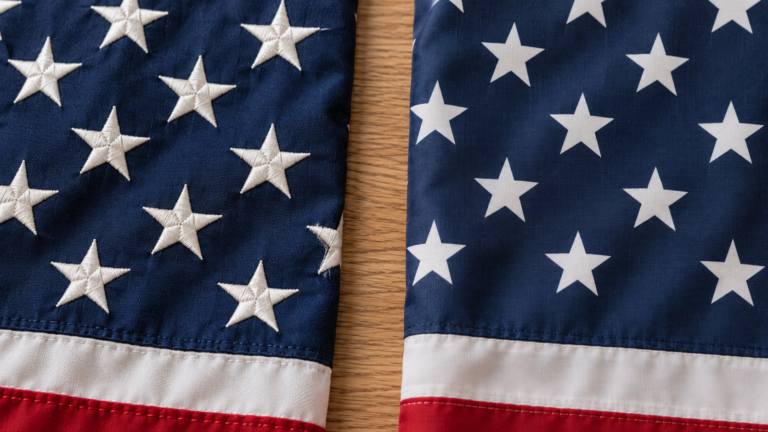 Close-up comparison of raised embroidered stars and smooth printed stars on American flag fabric